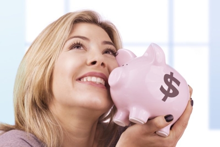 woman holding piggy bank